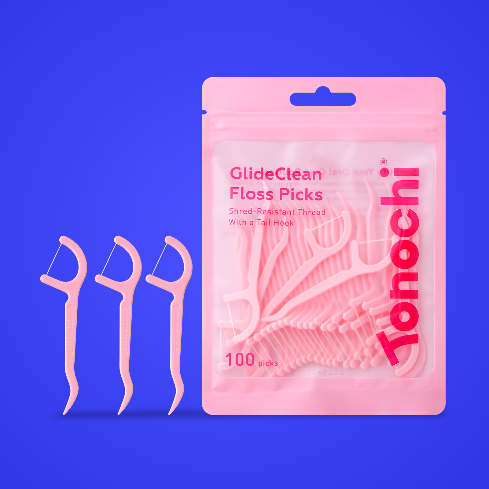 Pink Tonochi GlideClean floss picks with shred-resistant thread in resealable pouch on blue background