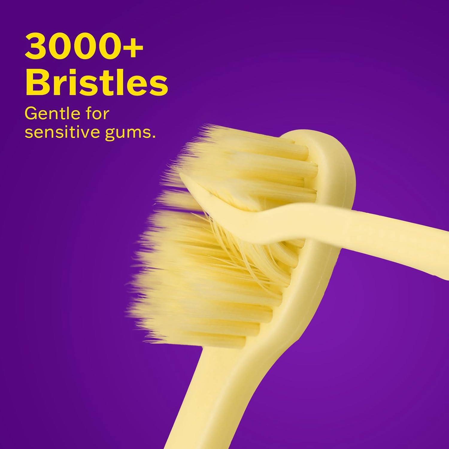Close-up of 3,000+ extra-soft yellow bristles on the Max Toothbrush, designed for a gentle clean on sensitive gums