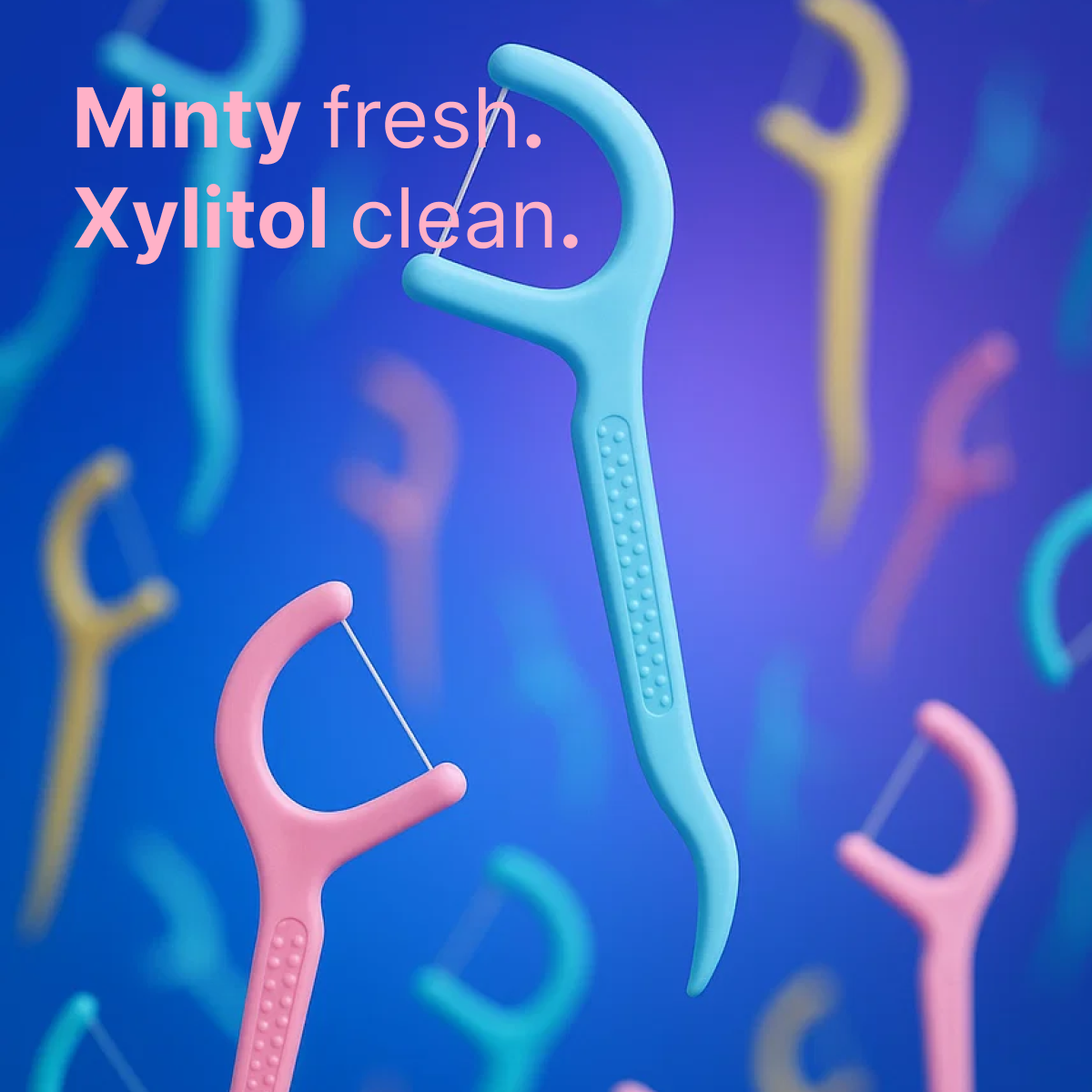 Colorful Tonochi floss picks in pink, blue, and yellow floating against a blue background with text Minty fresh. Xylitol clean.