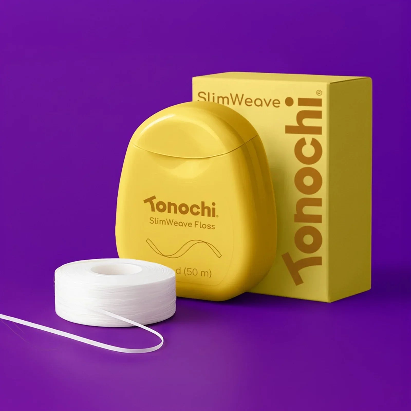 Yellow Tonochi SlimWeave Floss container and packaging with white dental floss on purple background