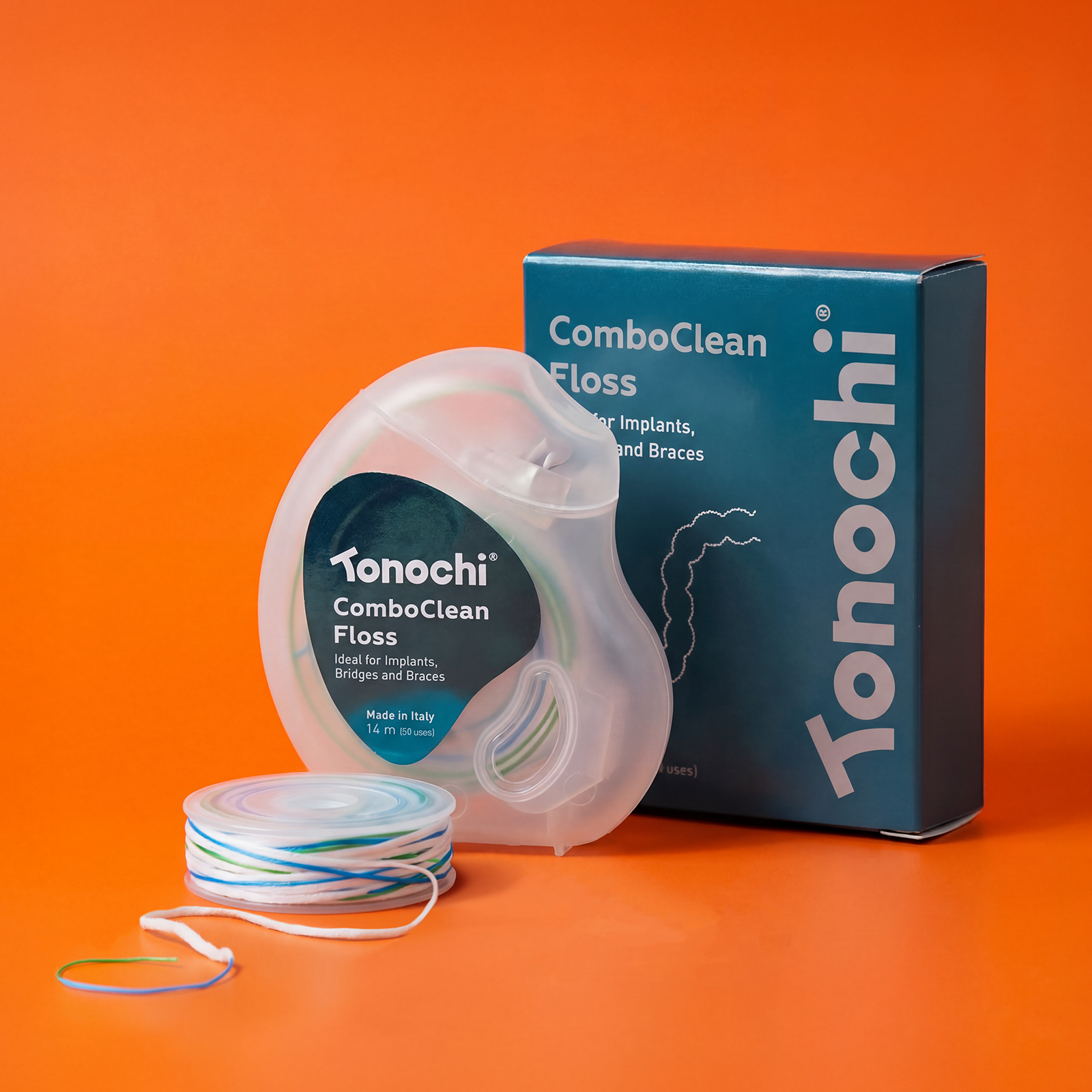 Tonochi ComboClean 2-in-1 floss for implants and braces. Blue box with transparent dispenser and bi-colored floss.