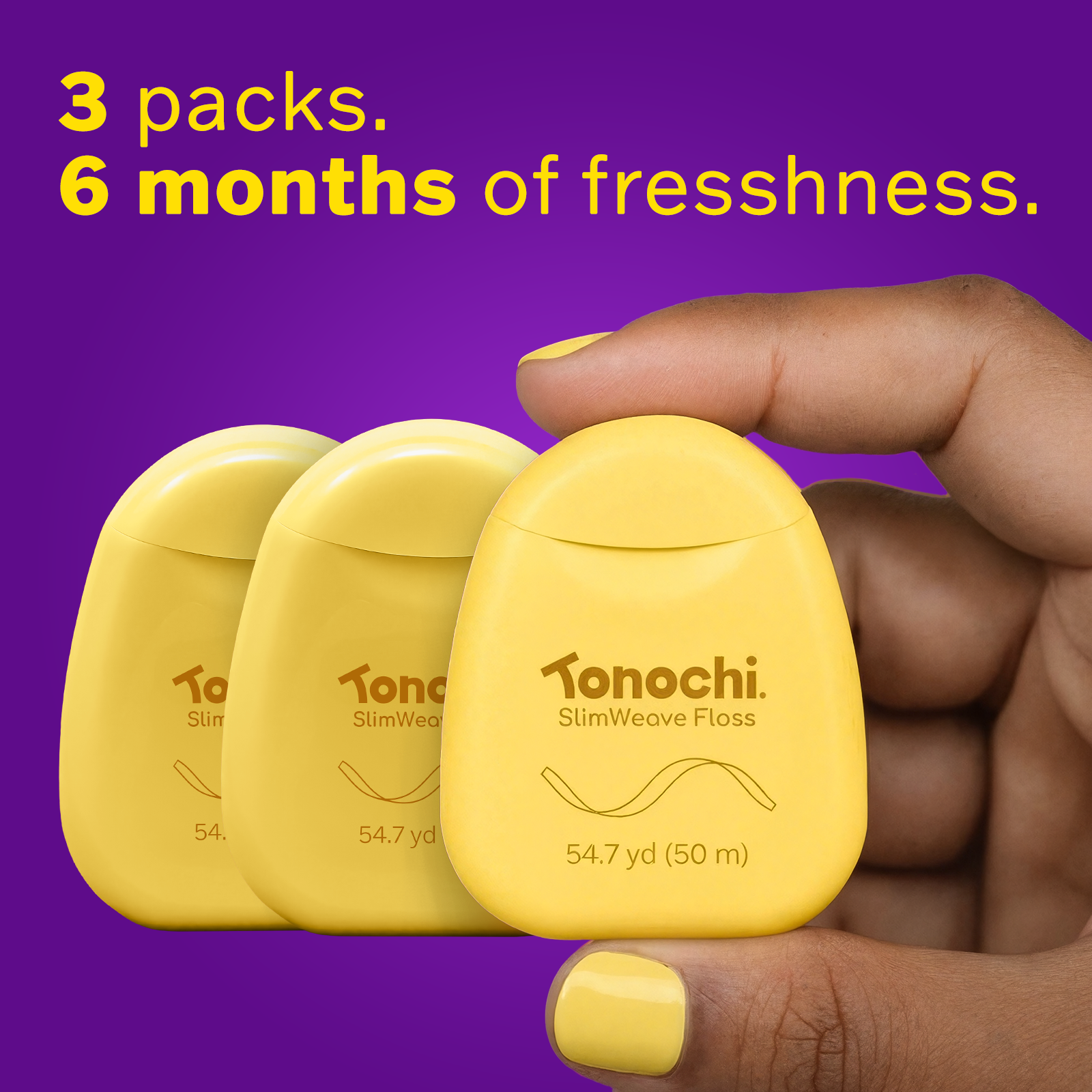 Three yellow Tonochi SlimWeave floss dispensers held in a hand, providing a 6-month supply of fresh care.