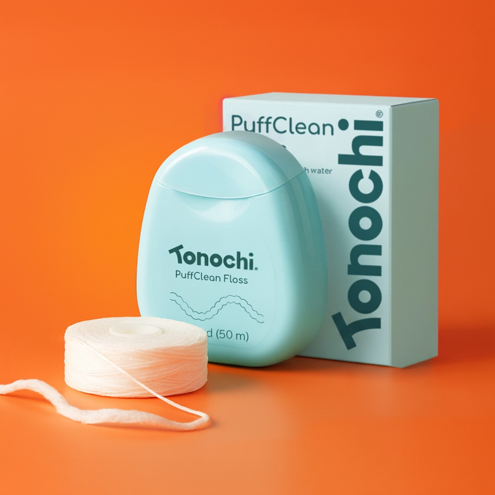 Tonochi PuffClean expanding dental floss 3-pack with mint green dispenser, white floss spool, and recyclable box.