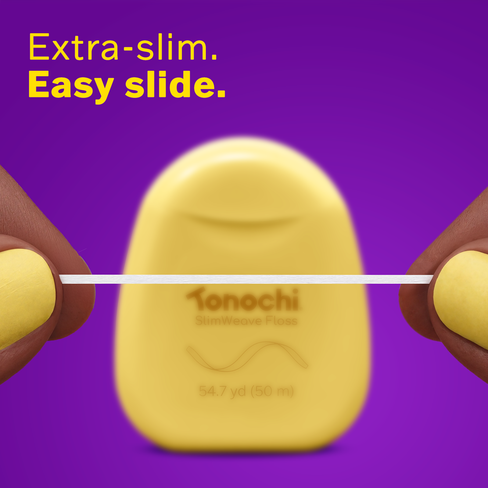 Close-up of yellow SlimWeave dispenser showing the ultra-thin, ribbon-like floss profile for an easy slide.