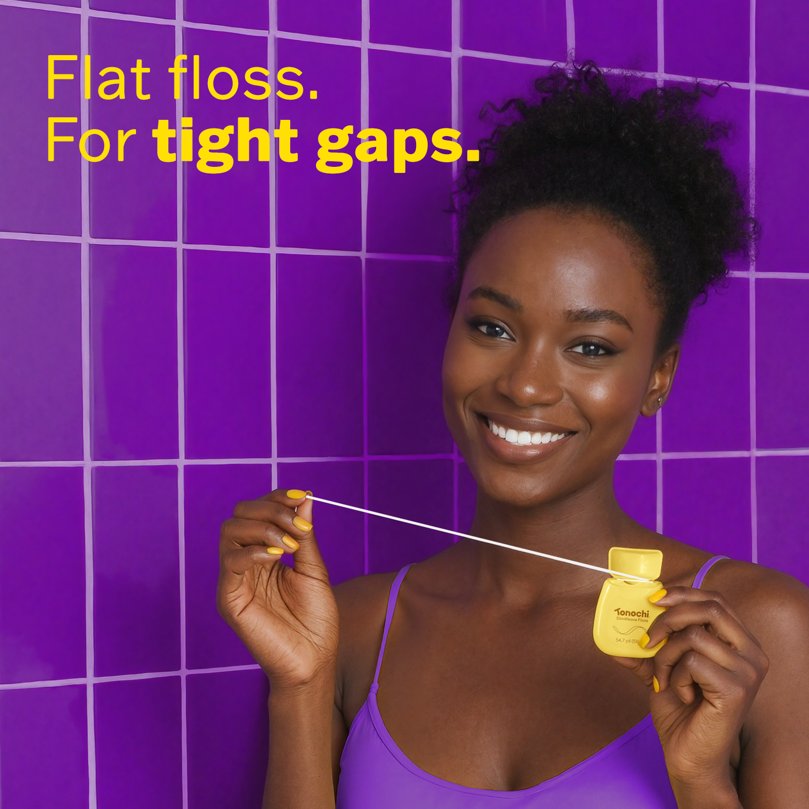 Woman using dental floss with text 'Flat floss. For tight gaps.' on a purple tiled background
