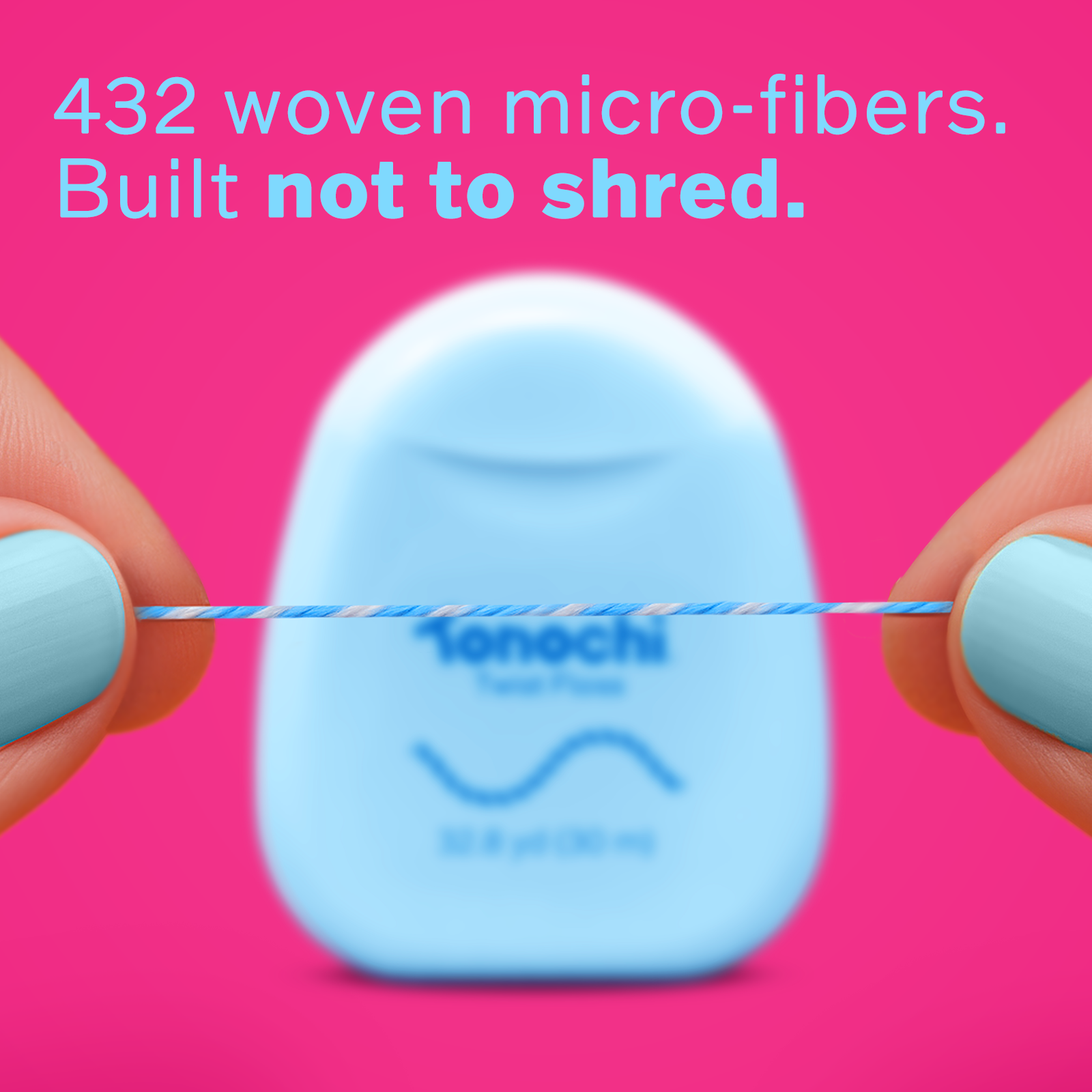 Close-up of blue and white two-tone braided dental floss designed to make removed plaque easy to see.
