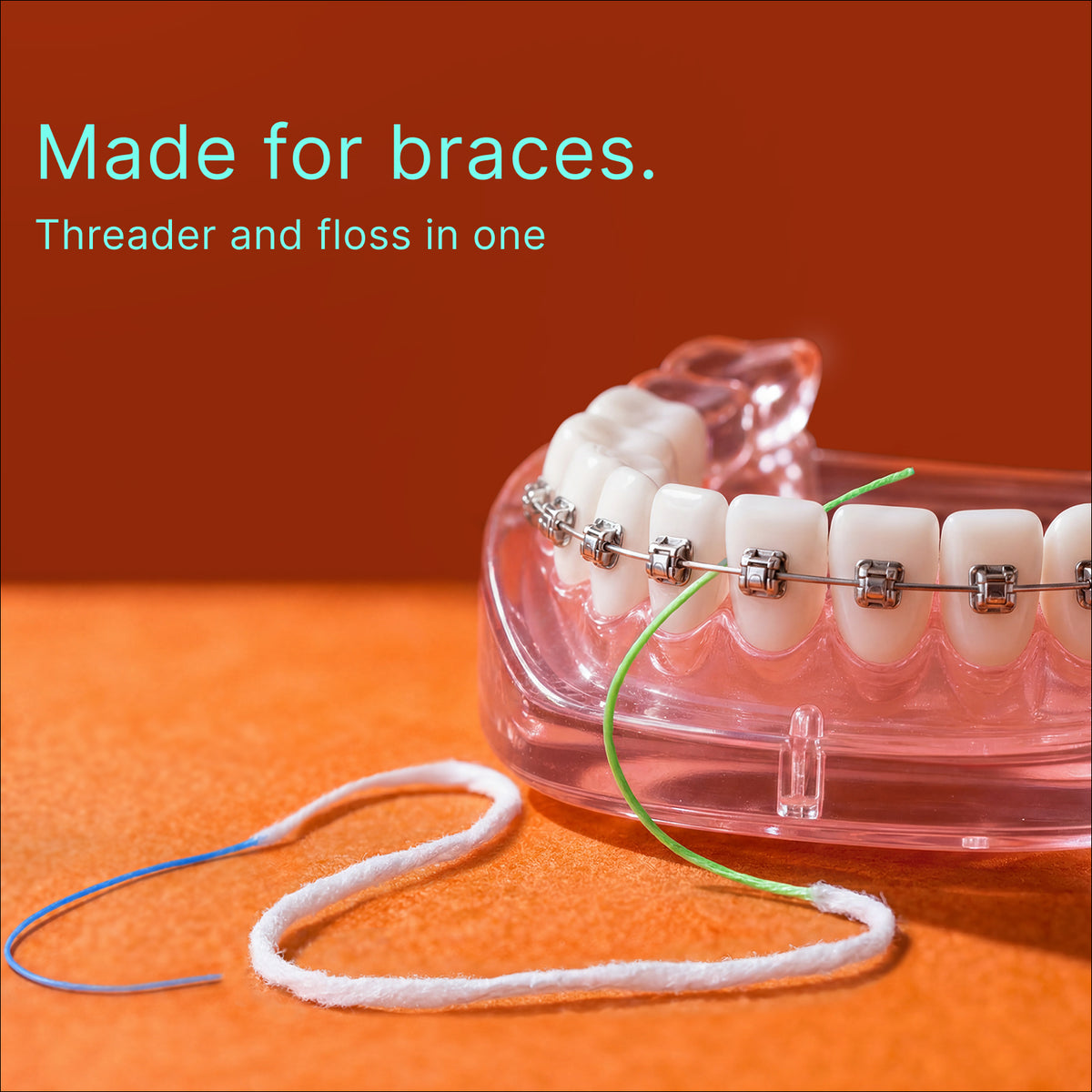 ComboClean floss on a dental model with braces: made for braces, threader and floss in one